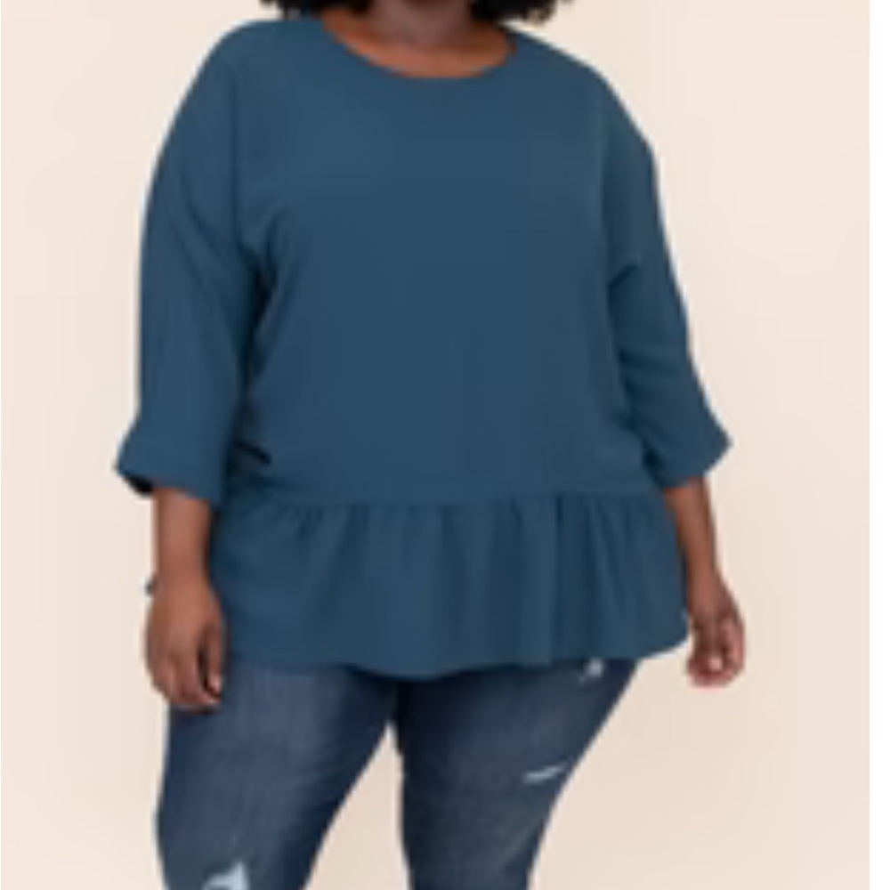 NWOT.  Woman’s round neckline blouse with 3/4 length sleeves & ruffle hemline.